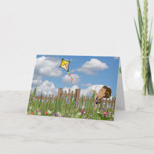 Carte Fille avec cerf-volant dans le jardin