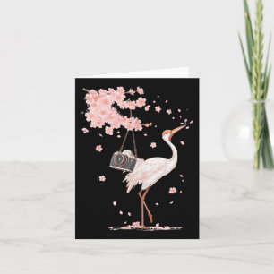 Carte Grue japonaise au Japon regarde avec un appareil p