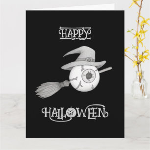 Carte Halloween balai sorcière et globe oculaire effraya