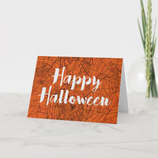 Carte heureuse orange de Halloween de toiles