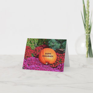 CARTE "HEUREUX CITROUILLE HALLOWEEN PARMI LES FLEURS"