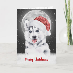 Carte Husky dans les flocons de neige et la lune