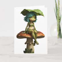 Jolie fille grenouille assise sur un champignon
