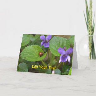 Carte Ladybug sur les fleurs de violet doux