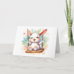 Carte Lapin de fantaisie à l'aquarelle sur une balançoir