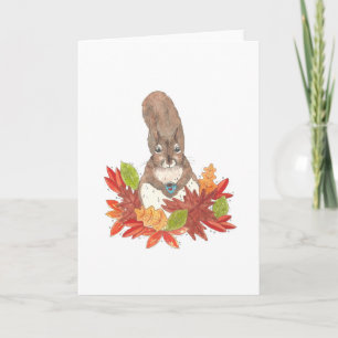Carte L'écureuil boit du café dans les feuilles d'automn