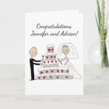 Les mariés coupent le gâteau de mariage. Félicita