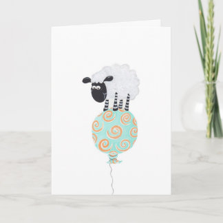 Carte moutons pelucheux sur le ballon tourbillonnant