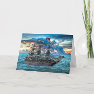 CARTE NAVIRE DE PIRATE ANCRÉ AU COUCHER DU SOLEIL