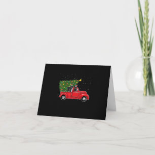 Carte Noël de chien de Terre-Neuve sur la voiture rouge 