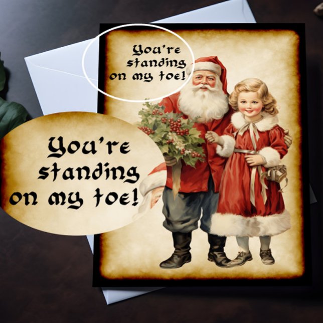 Carte Noël drôle Père Noël (A Victorian Christmas card with humorous picture on the front is lying on top of a desk.)