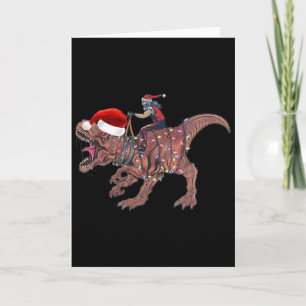 Carte Père Noël à cheval sur un dinosaure T Rex Noël Gar