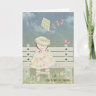 Carte petite fille avec un cerf-volant sur un banc pour