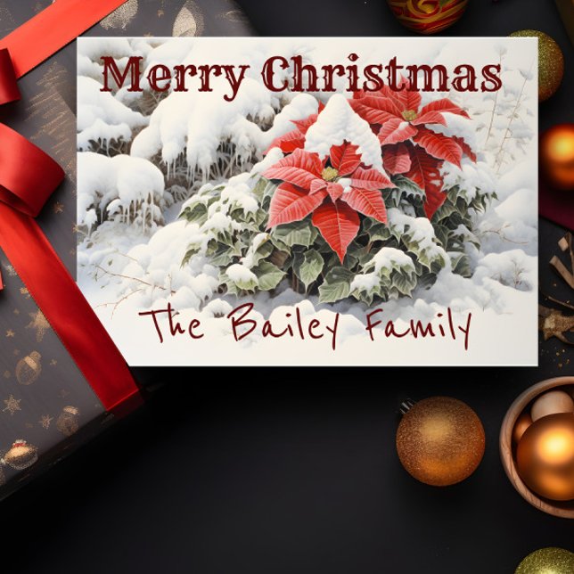 Carte Poinsettia Joyeux Noël (A Christmas card depicting red poinsettias in the snow is shown with a present and decorations.)