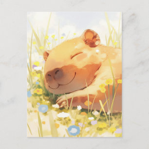 Carte Postale Capybara faisant la sieste dans une prairie ensole