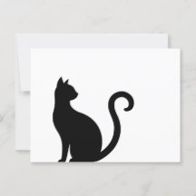 Chat noir assis