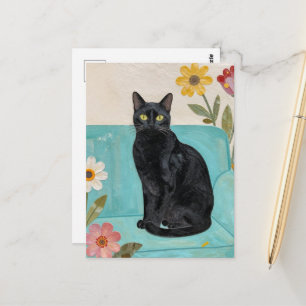 Carte Postale Chat noir sur un canapé bleu
