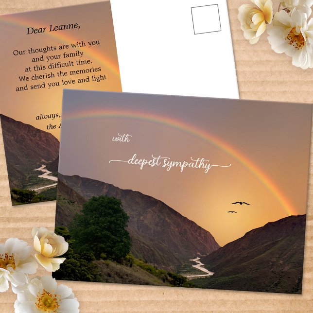 Carte postale Condoléances arc-en-ciel profonde (Sympathy postcard featuring a mountain scene with a river flowing into the ocean, with a rainbow)