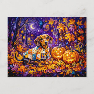 Carte Postale Dachshund assis parmi des citrouilles sous une nui