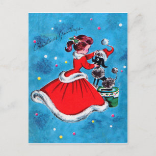 Carte Postale Fille en robe rouge préparant son chien pour Noël