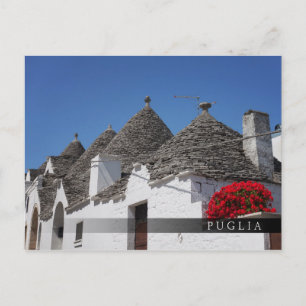 Carte Postale Fleurs de géranium et maisons de trulli à Alberobe