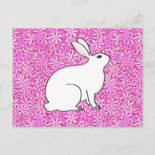 Carte Postale Lapin sur un lit de fleurs de printemps
