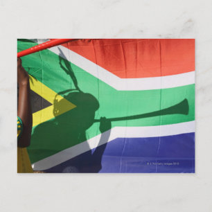 Carte Postale L'ombre d'un supporter du football soufflant la vu