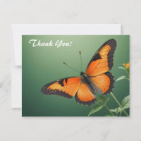 Papillon orange sur fond vert