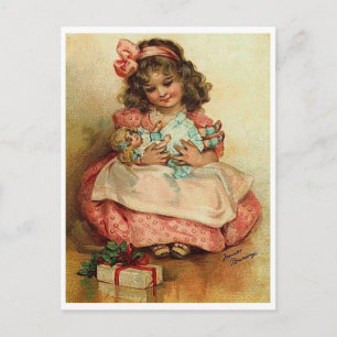 Carte Postale Petite fille avec sa poupée et son cadeau de Noël
