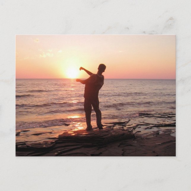 Carte Postale Sauter des rochers dans le coucher du soleil (Devant)