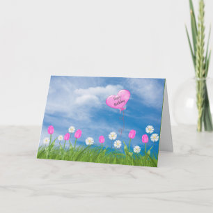 Carte tulipes et marguerites dans l'herbe