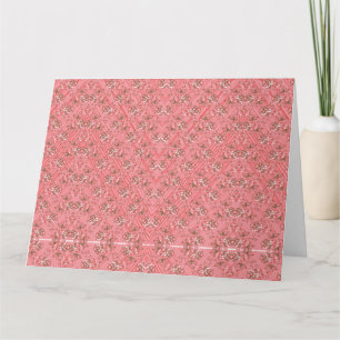 Carte Un tapis aux motifs rouges et roses présente un dé