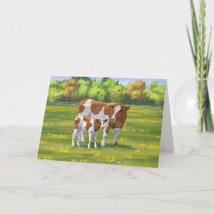 Carte Vache de Guernesey et veau mignon dans les pâturag