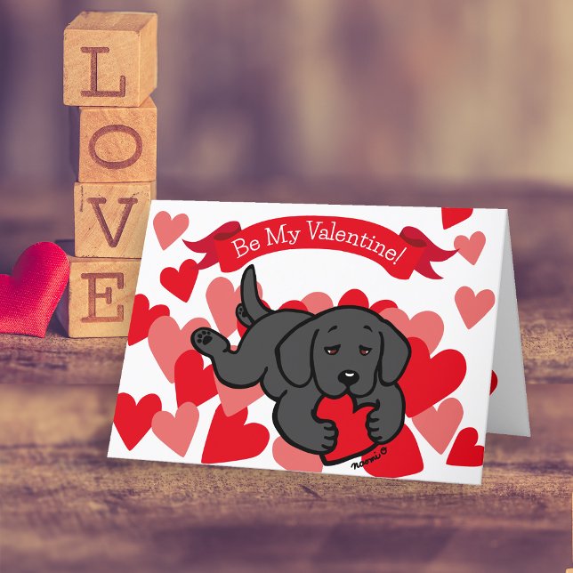 Cartes Pour Fêtes Annuelles Black Labrador Chiot Coeur à mâcher Valentine (Black Labrador Puppy Chewing Heart Valentine's Day Cards for Labrador Owners.  Cute Cartoon design.)