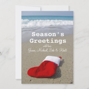 Cartes Pour Fêtes Annuelles Chaussette de Santa Claus posée sur une belle plag