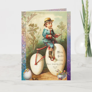 CARTES POUR FÊTES ANNUELLES CHILD WITH EASTER EGG BIKE AND COLORFUL FLOWERS