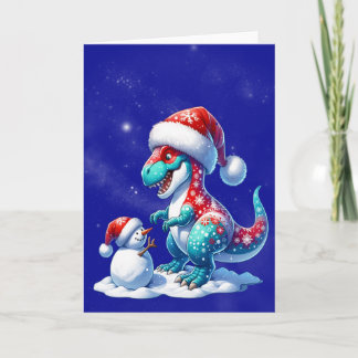 Cartes Pour Fêtes Annuelles Dinosaur with santa hat building a snowman