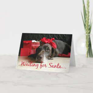 Cartes Pour Fêtes Annuelles en attente de pointeur père Noël et cadeaux au foy