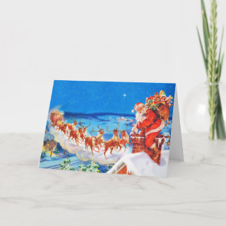 Cartes Pour Fêtes Annuelles Le Père Noël et son renne sur le toit