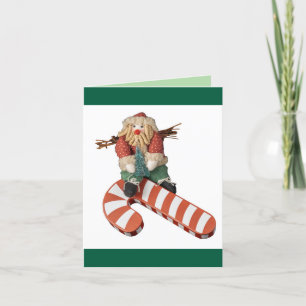 Cartes Pour Fêtes Annuelles Le Père Noël glisse un sucre de canne Noël