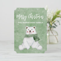 Ours polaire portant une écusson verte Joyeux Noël