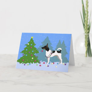Cartes Pour Fêtes Annuelles Rat Terrier décorant un sapin de Noël en forêt