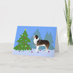 Cartes Pour Fêtes Annuelles Un chien berger australien décorant un arbre de No