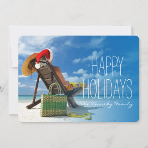 Cartes Pour Fêtes Annuelles Un homme se reposant sur la plage à père Noël casq