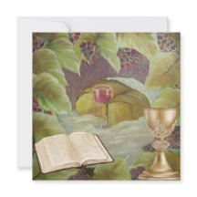 White cloth with wine and bread surounded by green