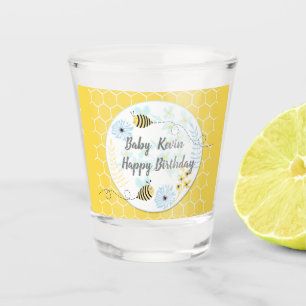 Cartoon bumblebees on a background of blue, yellow shot glass
