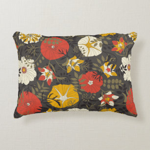 cartoon leaves and flowers on a dark background in accent pillow