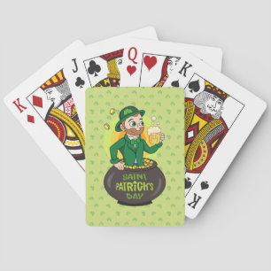 Cartoon leprechaun in a pot of gold holding a pint playing cards