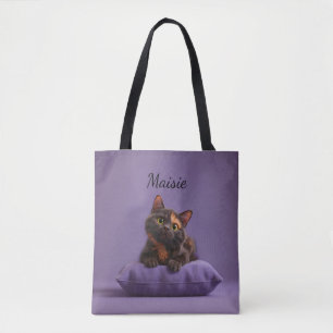 Cartoon Tortoiseshell Kitten on Purple Cushion Tote Bag