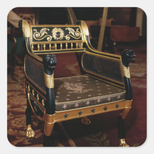 Carved armchair with gilt details square sticker
